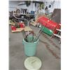 Image 1 : Garbage can with 2 rakes, bucksaw, shovels