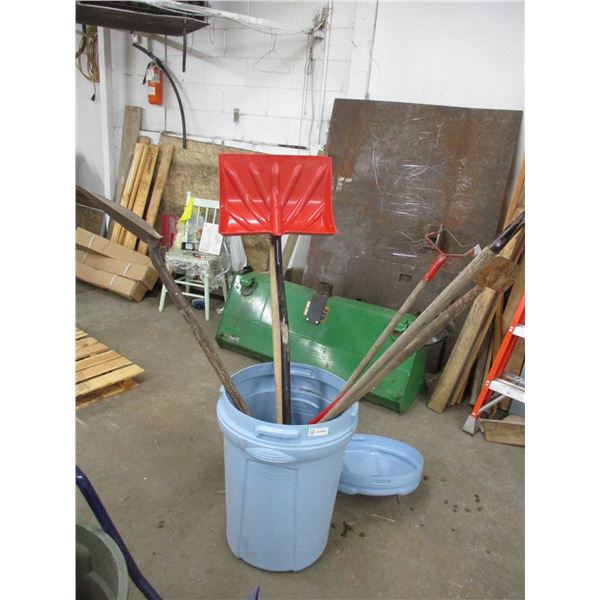 Garbage can with hoe, spade, rake, chipper, snow scoop