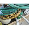 Image 4 : Shopping cart, garden hose, cords, broom, misc