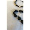 Image 2 : 2 VINTAGE GOLD TONE BANGLES AND TWO SKULL BEAD BRACELETS