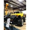 Image 2 : 2 REMOTE CONTROLLED CARS, REMOTE CONTROLLER CRANE AND WOOD MODEL FORKLIFT WITH PALLETS (NO FORKS)