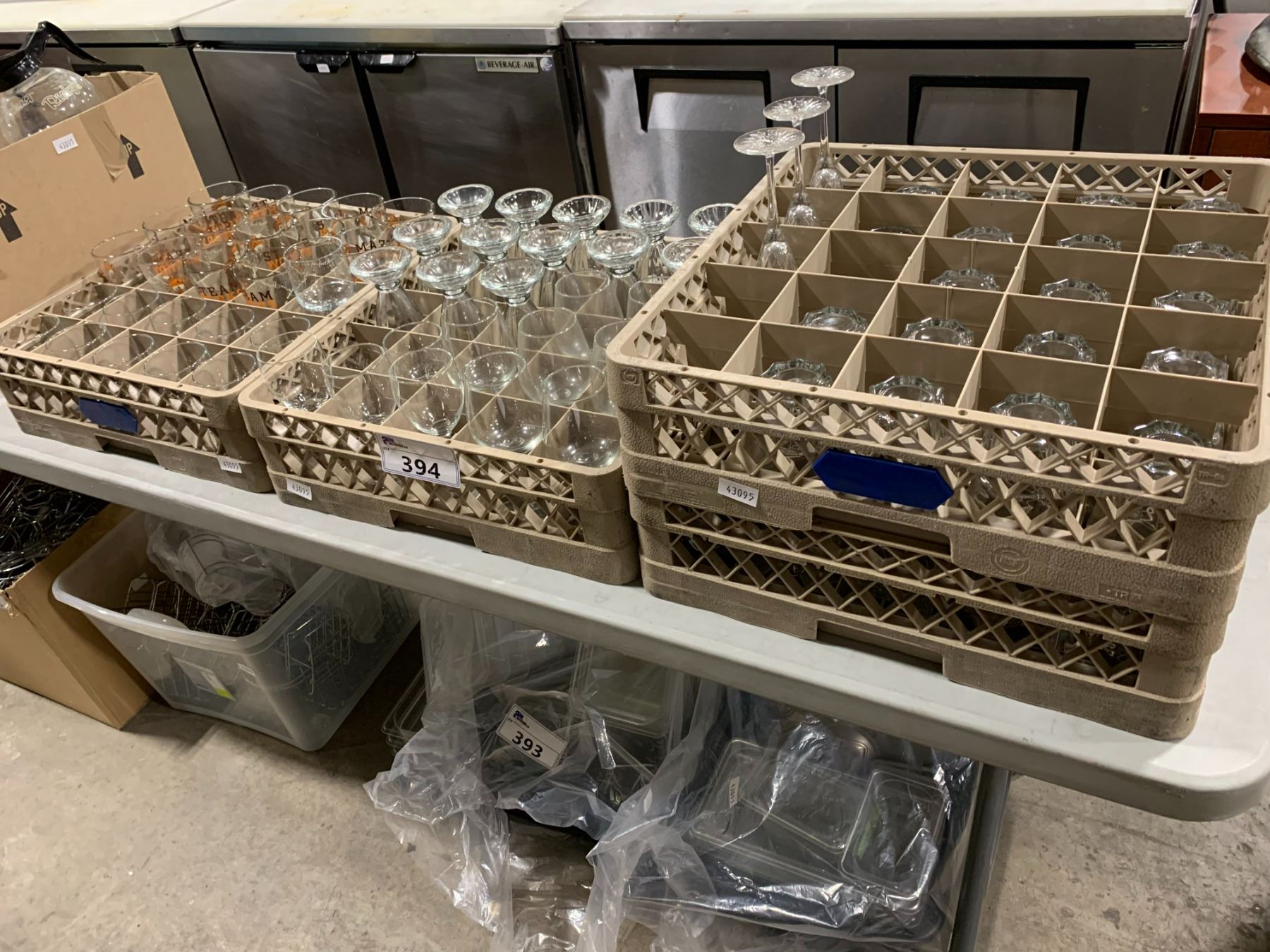 4 PLASTIC GLASS TRAYS WITH ASSORTED RESTAURANT GLASSWARE