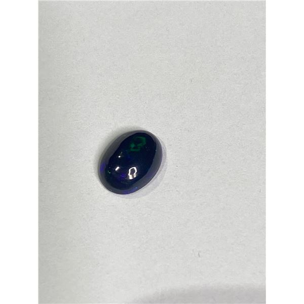 BLACK OPAL 1.13CT. 9.77 X 7.30 X 3.48MM. OVAL CABOCHON - PLAY OF COLOUR ETHIOPIA