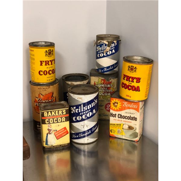 Group of vintage collectible cocoa tin cans (approx. 9 pieces)