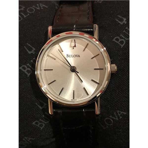 New Bulova lady's wrist watch w/black leather strap (new and box)