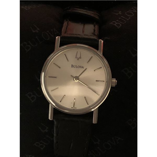 New Bulova lady's wrist watch w/black leather strap (new and box)