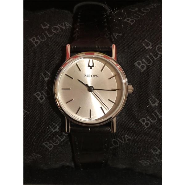 New Bulova lady's wrist watch w/black leather strap (new and box)