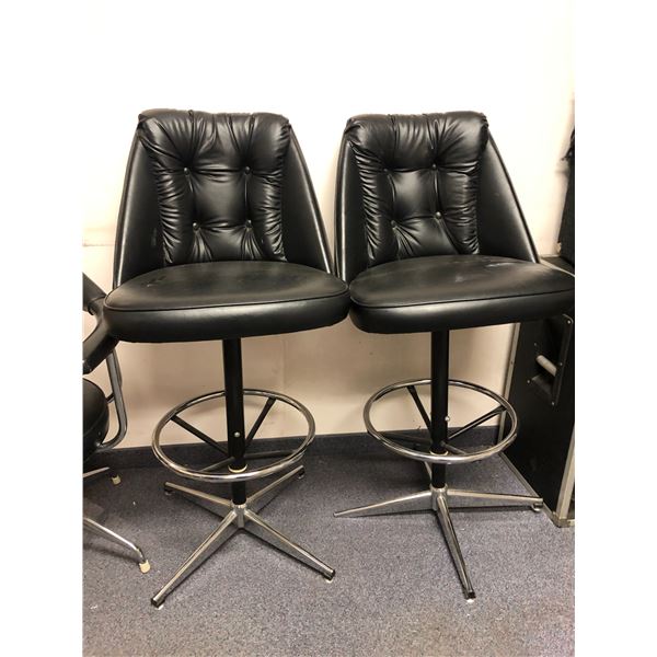 A pair of leather bar chairs