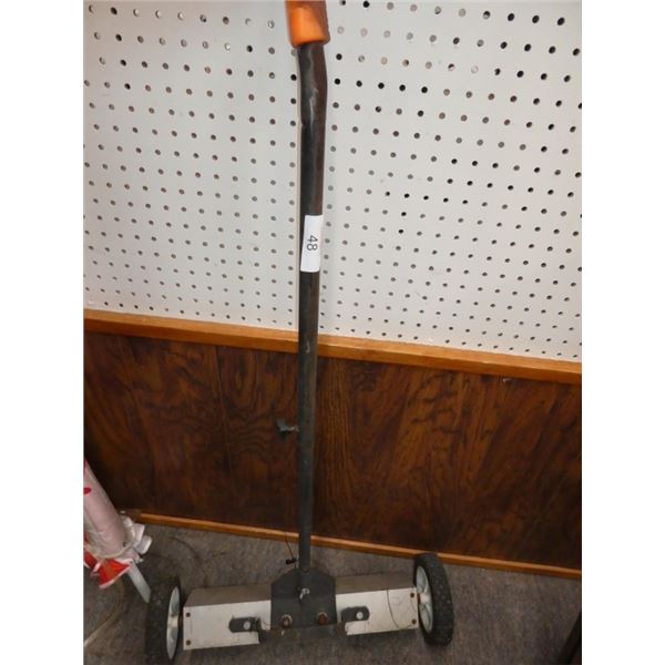 Wheeled push magnetic