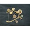 Image 1 : 18K YELLOW GOLD CHARM BRACELET WITH 14K CHARMS