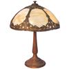 Image 1 : Table lamp, shade has 6 bent panels of caramel slag glass, heavy cast metal base, VG working cond w/