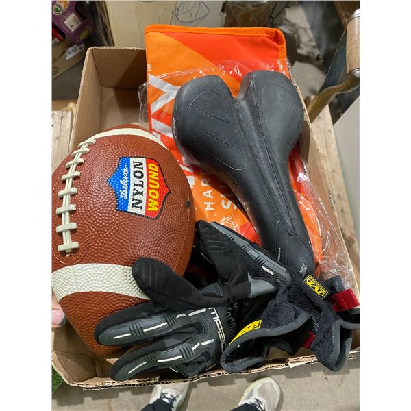 Bike seat, football and gloves
