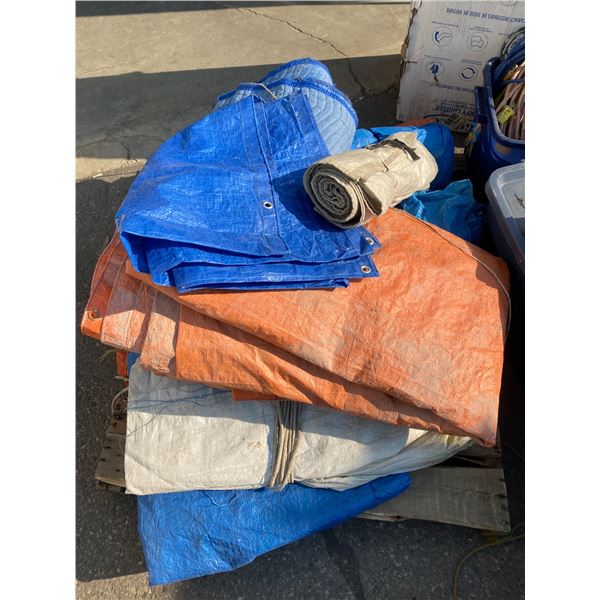 Large lot of tarps and one moving blanket