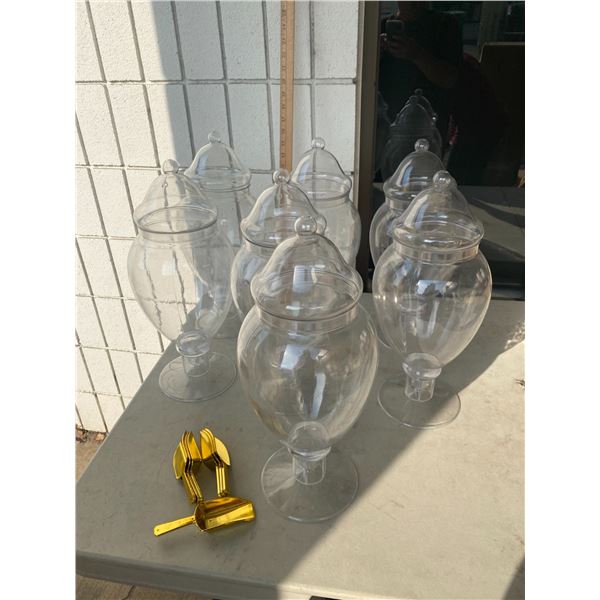 7 plastic lidded containers with scoops sweet jars