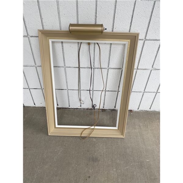 Frame with light inside frame measures 18"x 24"