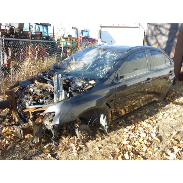 Black 4 door car for scrap