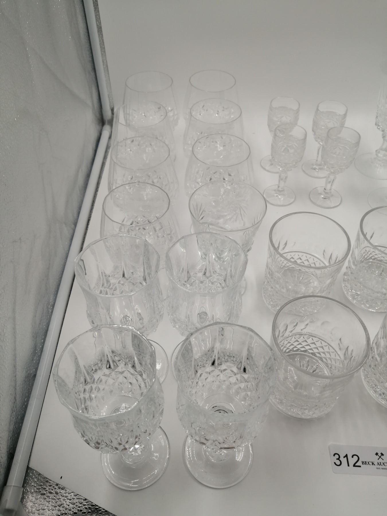 Assortment of Crystalware Includes Decanter, Stemware, Tumbler, and