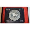 Image 3 : 1973 RCMP Centennial Specimen Silver Dollar. Lightly Toned and housed in its original black clamshel