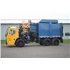 Image 1 : Mack LEU600 tandem axle, garbage truck, side load, very low use, 4,100 kms, yellow, 2015, dual camer