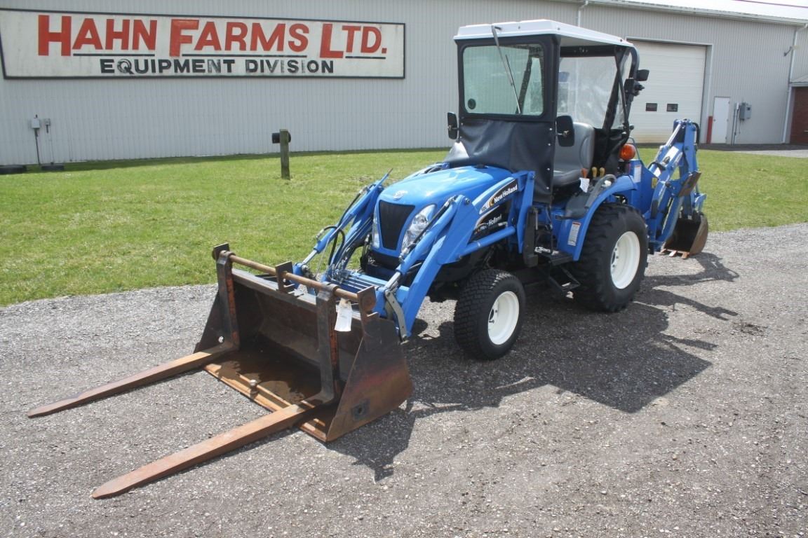 New Holland TC26DA 4wd compact tractor, NH 12LA loader, NH 756C backhoe