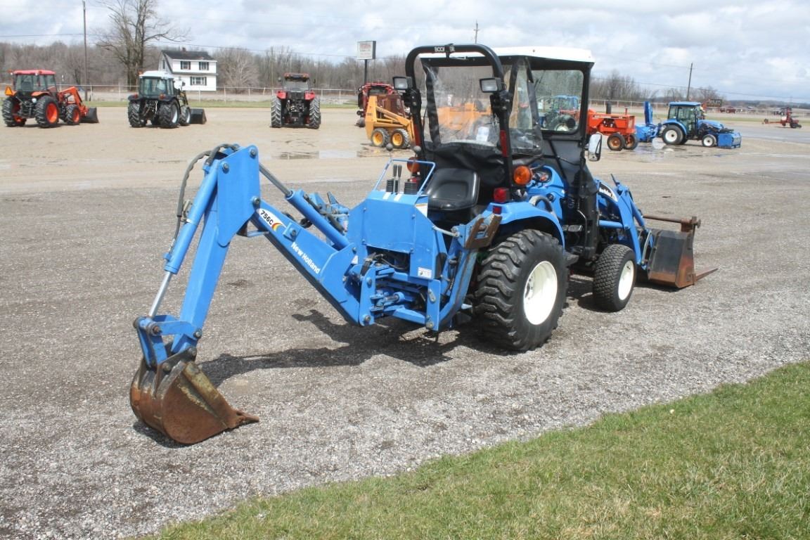 New Holland TC26DA 4wd compact tractor, NH 12LA loader, NH 756C backhoe