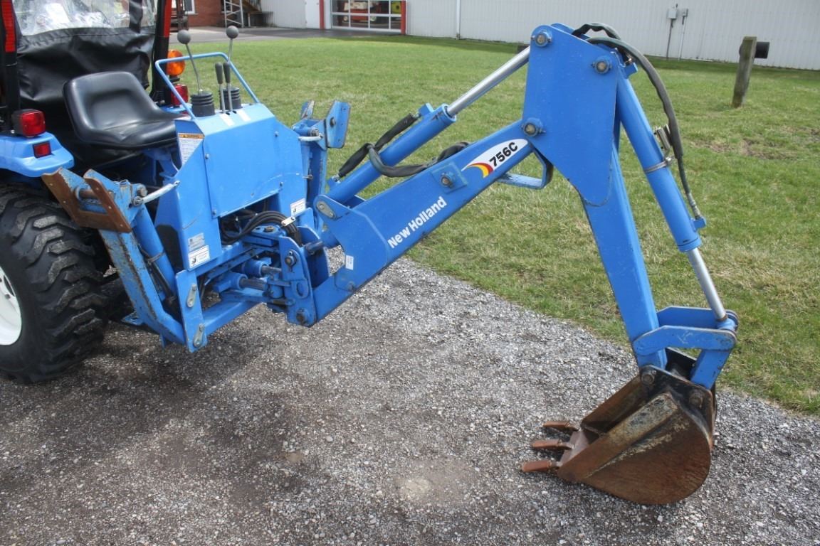 New Holland TC26DA 4wd compact tractor, NH 12LA loader, NH 756C backhoe