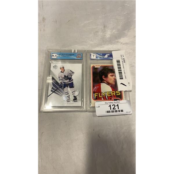 1981 OPC #240 BOBBY CLARK CARD GRADED 7 AND 2017 UD SP AUTHENTIC #66 WILLIAM NYLANDER CARD GRADED 9.