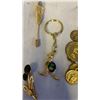 Image 7 : BAG OF MISC. GOLD TONE JEWLERY - 2 NECKLACES, KEYCHAIN, 2 PINS, AND WOOD PENDANT