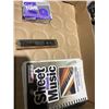 Image 1 : Harmonica, guitar tuner and piano sheet music