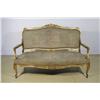 Image 1 : A Louis XV Canapé with Arched Padded Back and Bowed Seat Covered in Petit Point Needlework in Moulde
