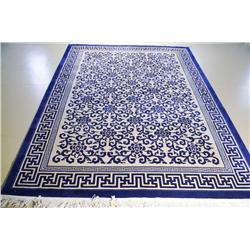 A Contemporary Blue Wool Rug with Asian Motif,