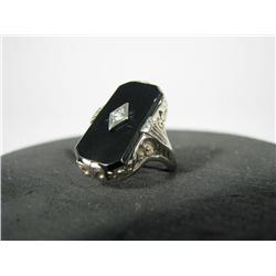 An onyx & diamond 14K white gold ring.