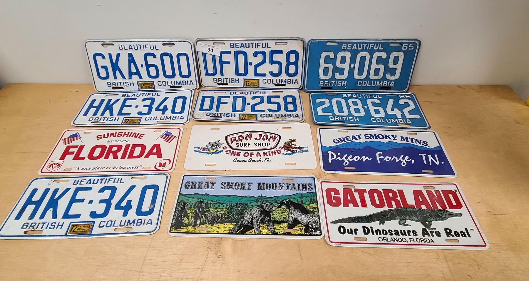 12 VINTAGE LICENSE PLATES & COURTESY PLATES