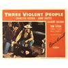 Image 1 : Three Violent People signed lobby card