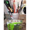 Image 1 : Rubbermaid 121L Trash Can Full of Garden Tools
