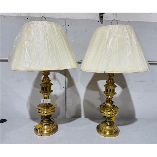 Pair of brass lamps