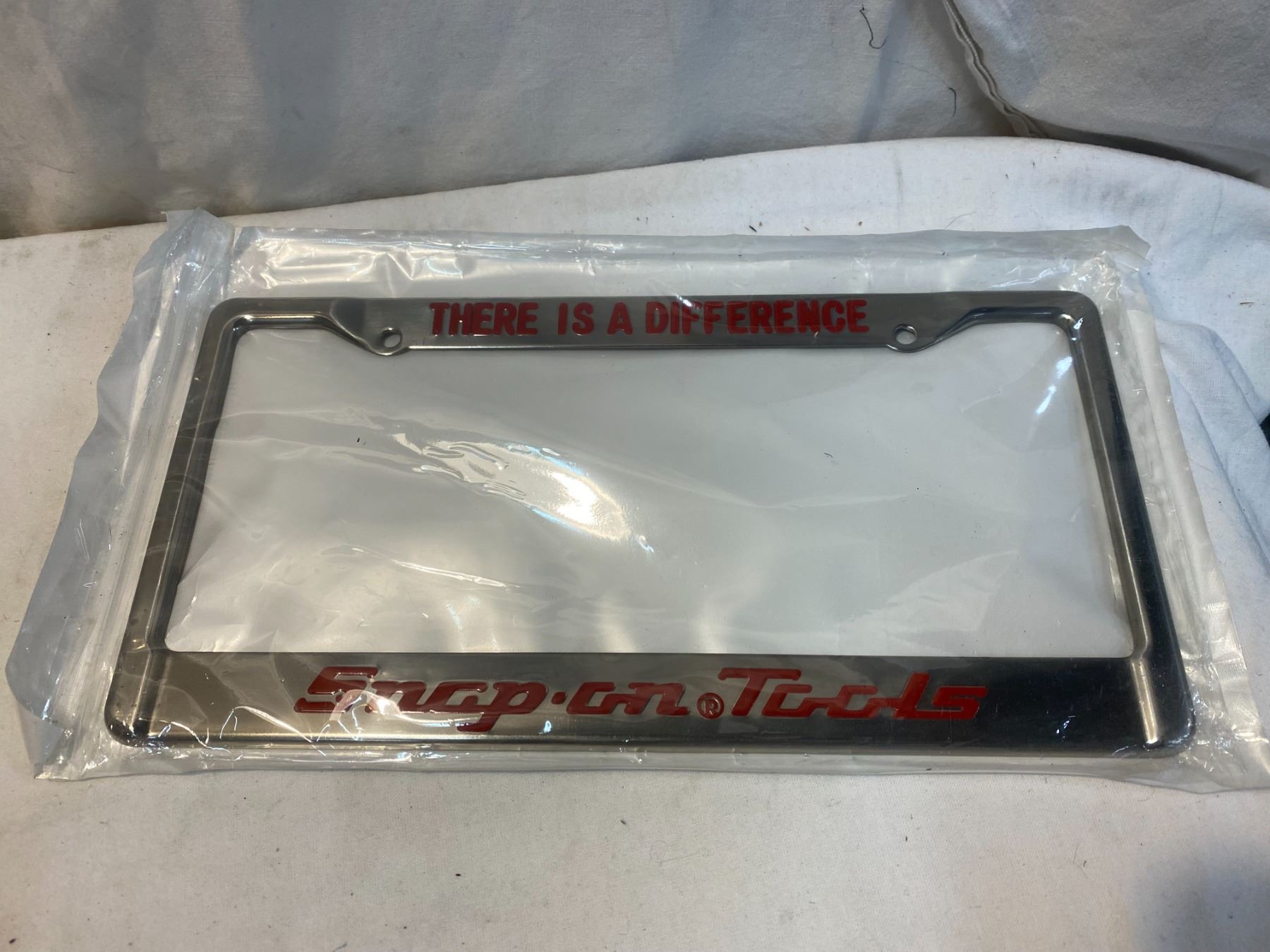 Snap on tools license plate surround