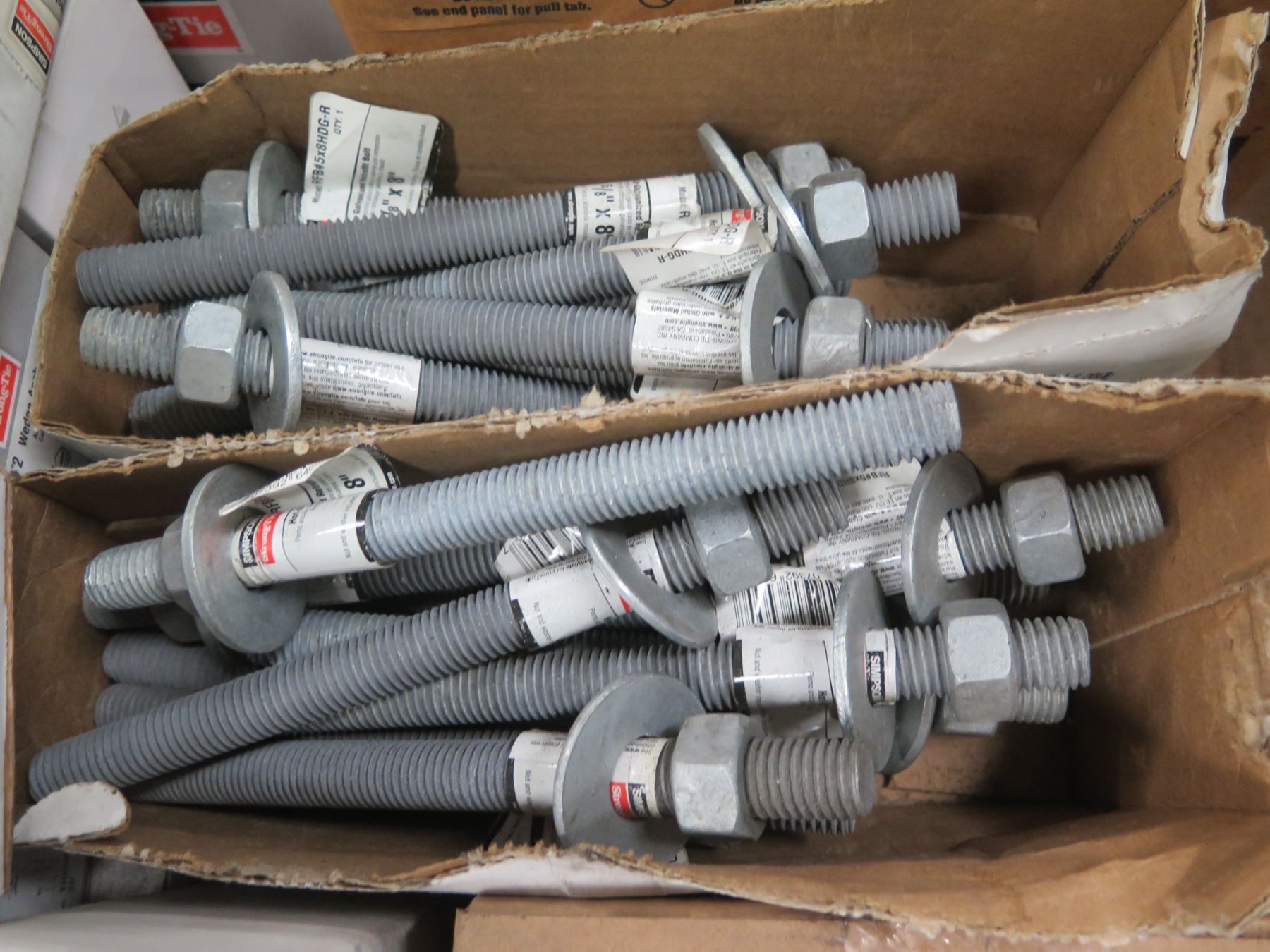 Multiple Boxes Simpson Strong Tie Wedge Anchors, Titan Screw Anchors, etc