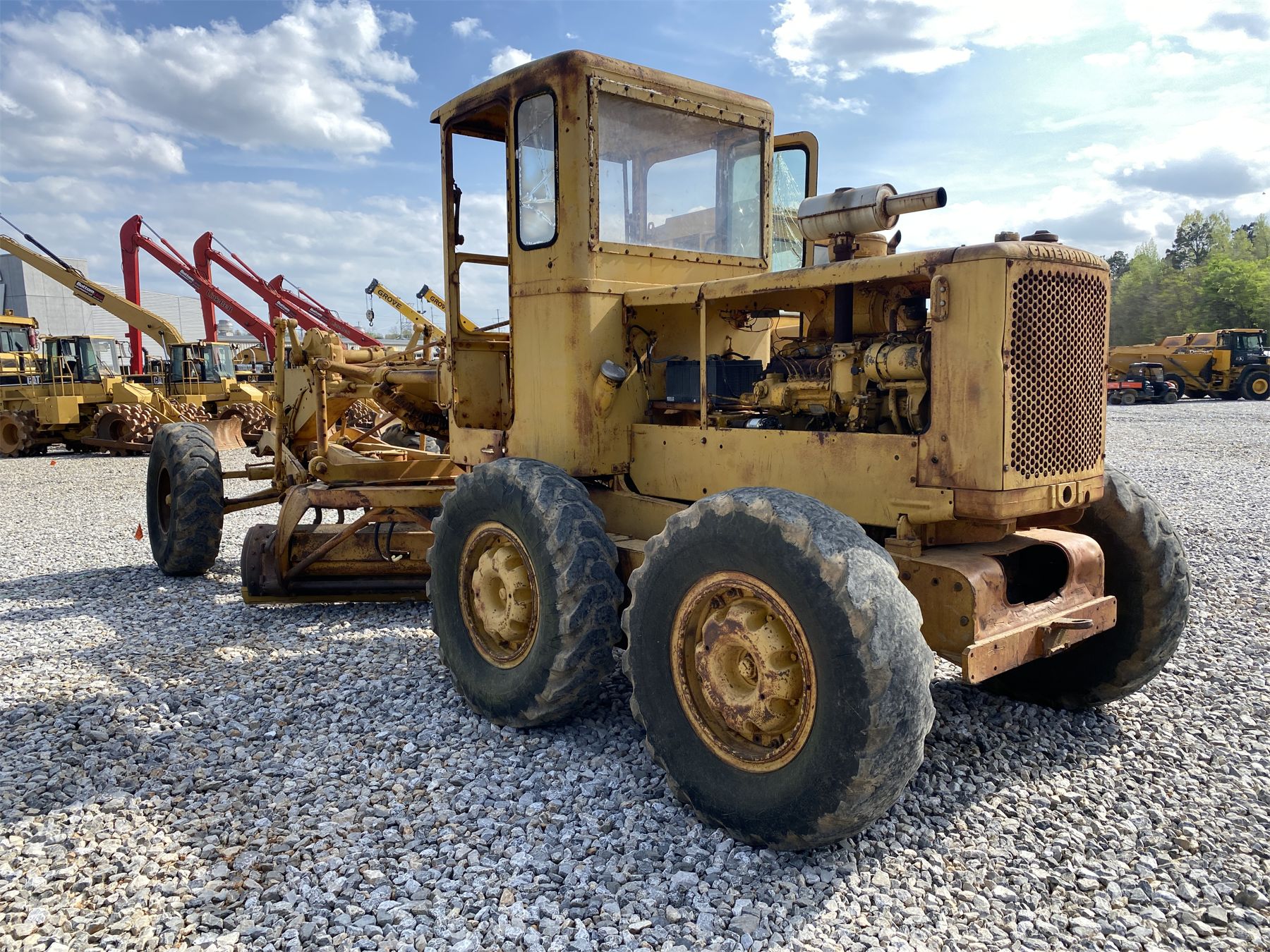 1965 CAT 12 Motor Grader - J.M. Wood Auction Company, Inc.
