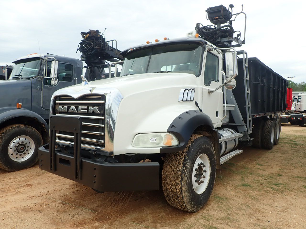 2006 MACK CT713 Grapple Truck - J.M. Wood Auction Company, Inc.