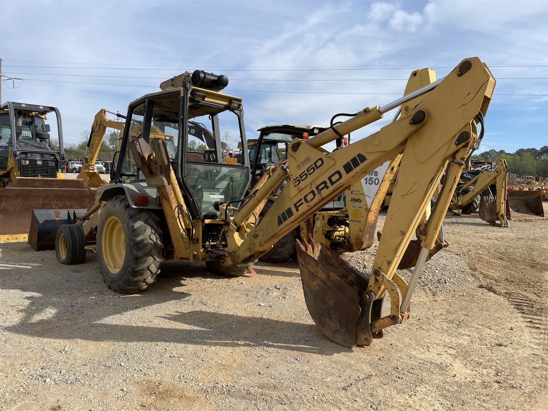 FORD 555D Backhoe J.M. Wood Auction Company, Inc.