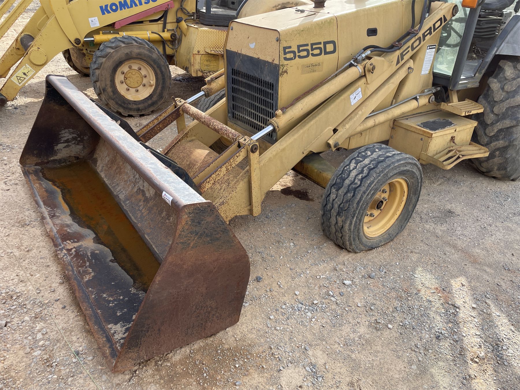FORD 555D Backhoe J.M. Wood Auction Company, Inc.