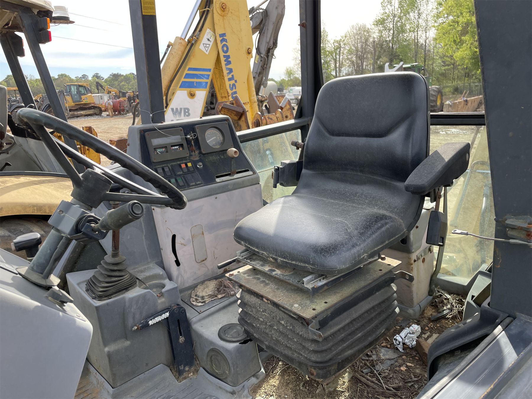 FORD 555D Backhoe J.M. Wood Auction Company, Inc.
