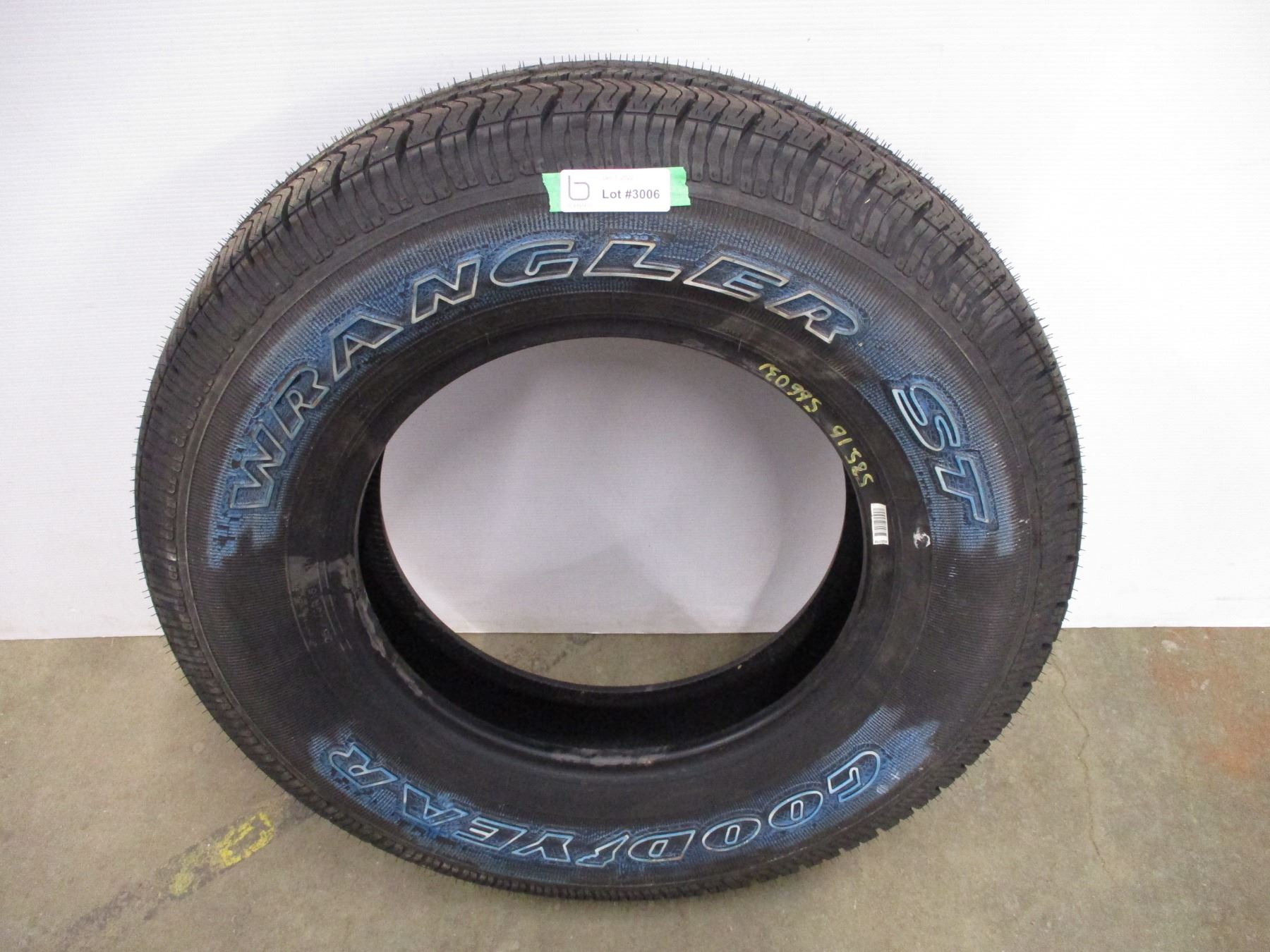 *Goodyear Wrangler ST Tire - P225/75R16 - Bodnarus Auctioneering
