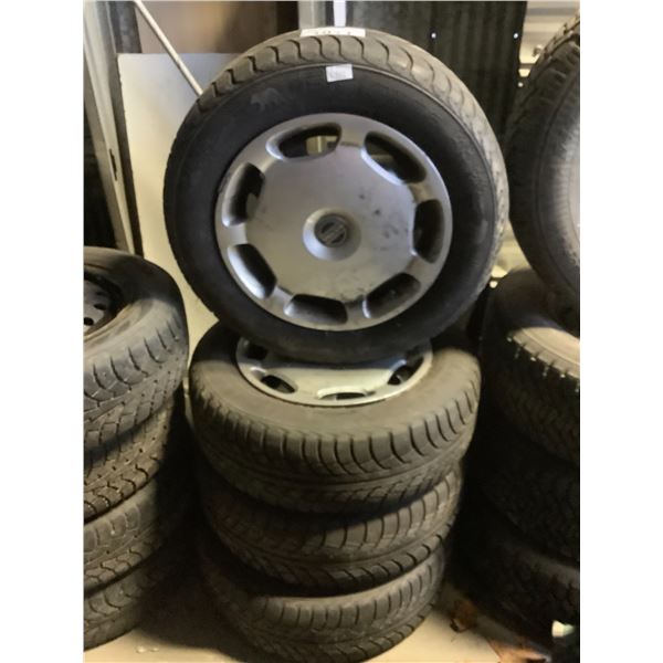 4 NORD FROST 5 TIRES MOUNTED ON VOLVO RIMS WITH HUBCAPS 195/65 R15