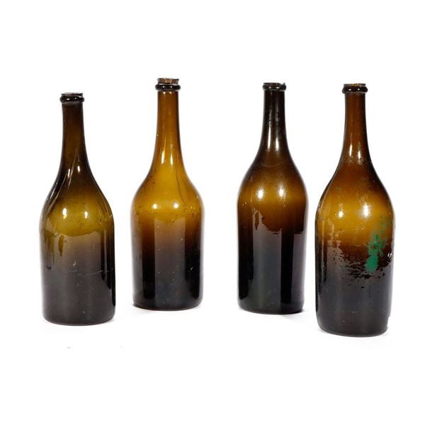 Four Vintage Champagne Bottles.