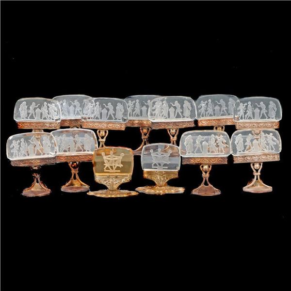 Set of eleven Austrian intaglio glass place card holders, with two similar.