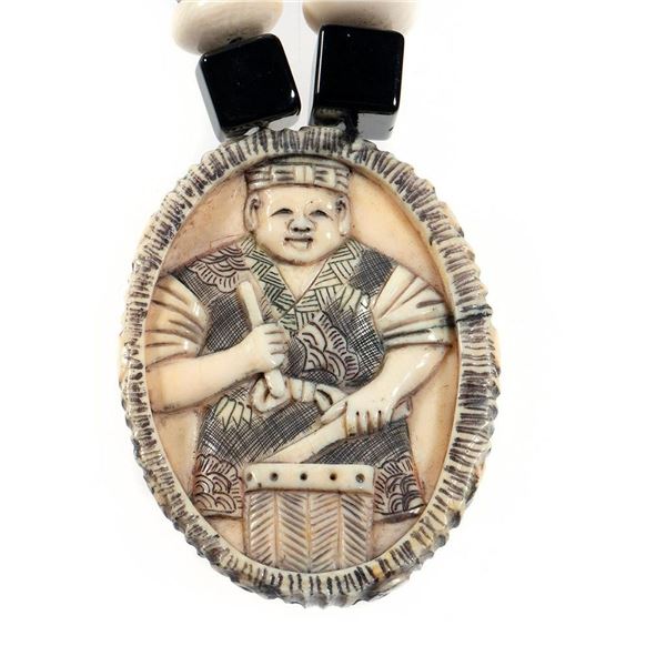 Chinese carved pendant and beaded necklace.