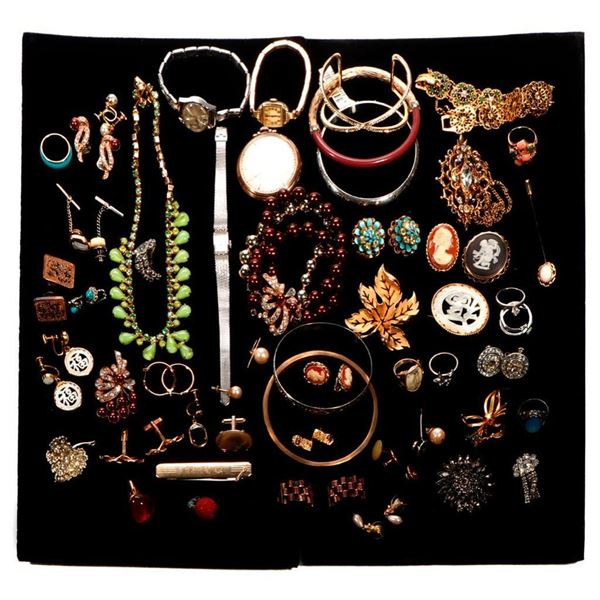 Collection of vintage costume jewelry and watches.