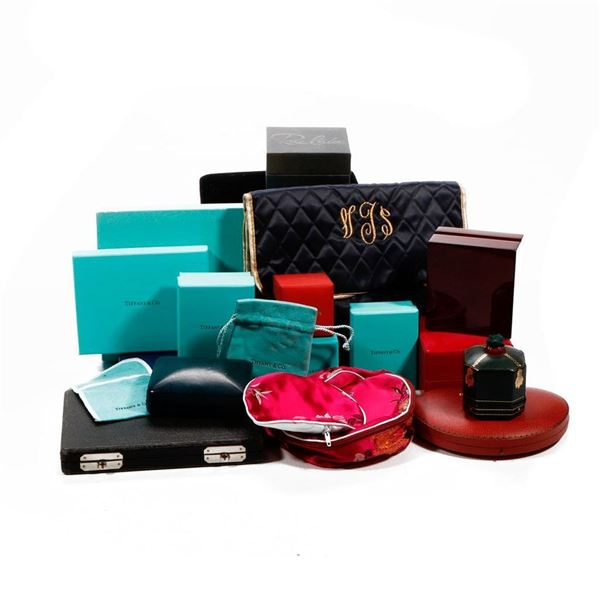 Group of jewelry boxes and pouches.